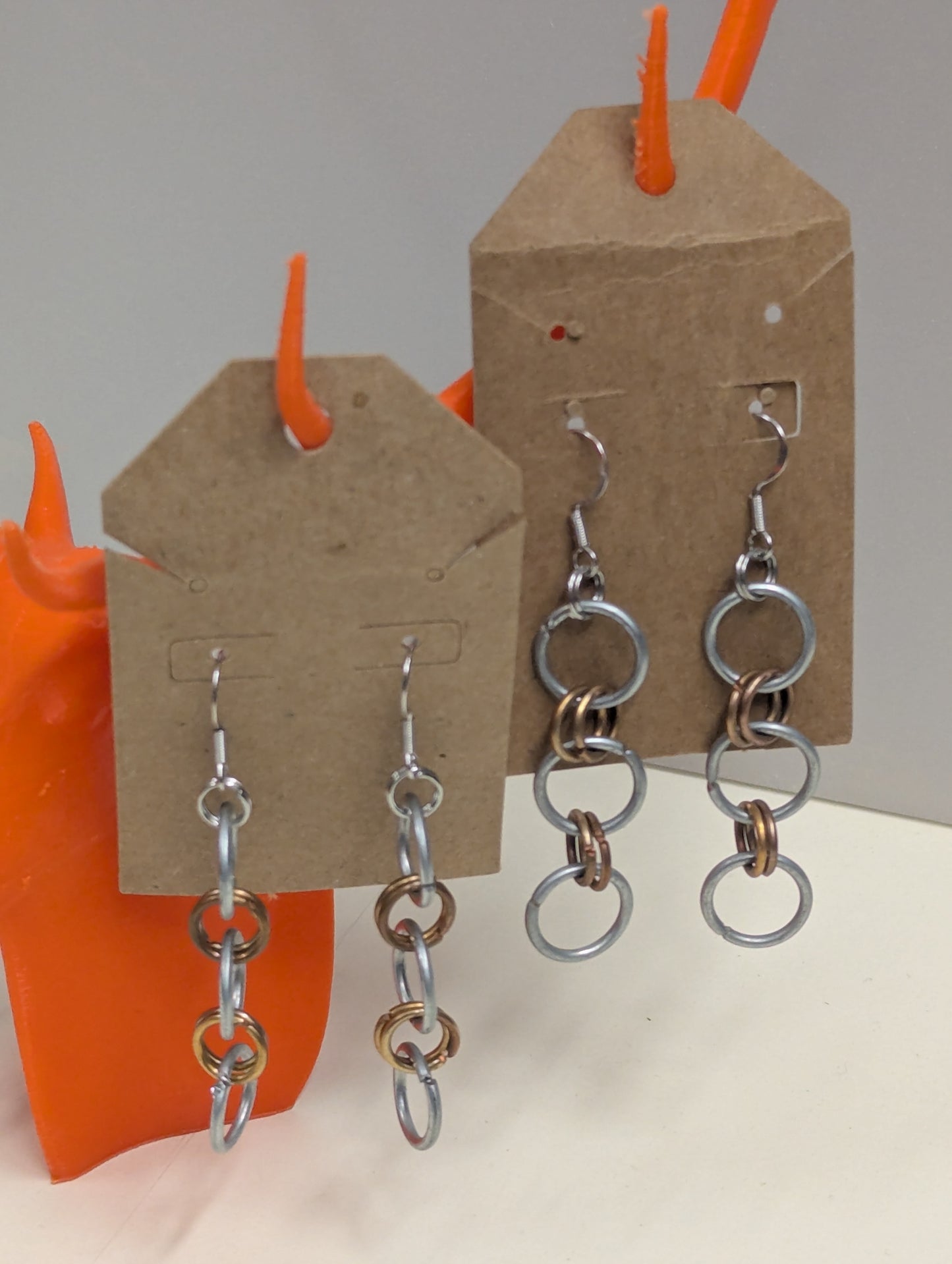 steel and copper hoop earrings