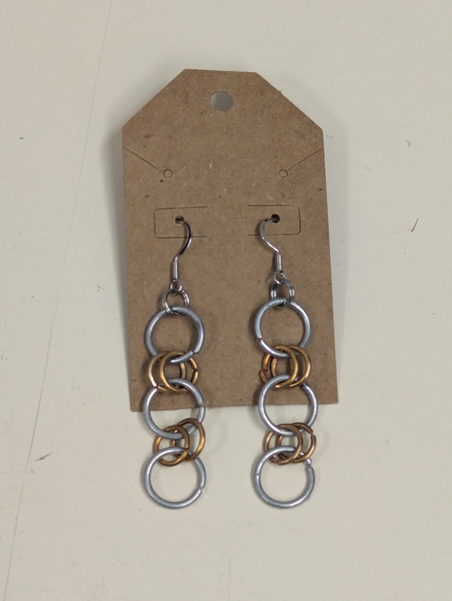 steel and copper hoop earrings