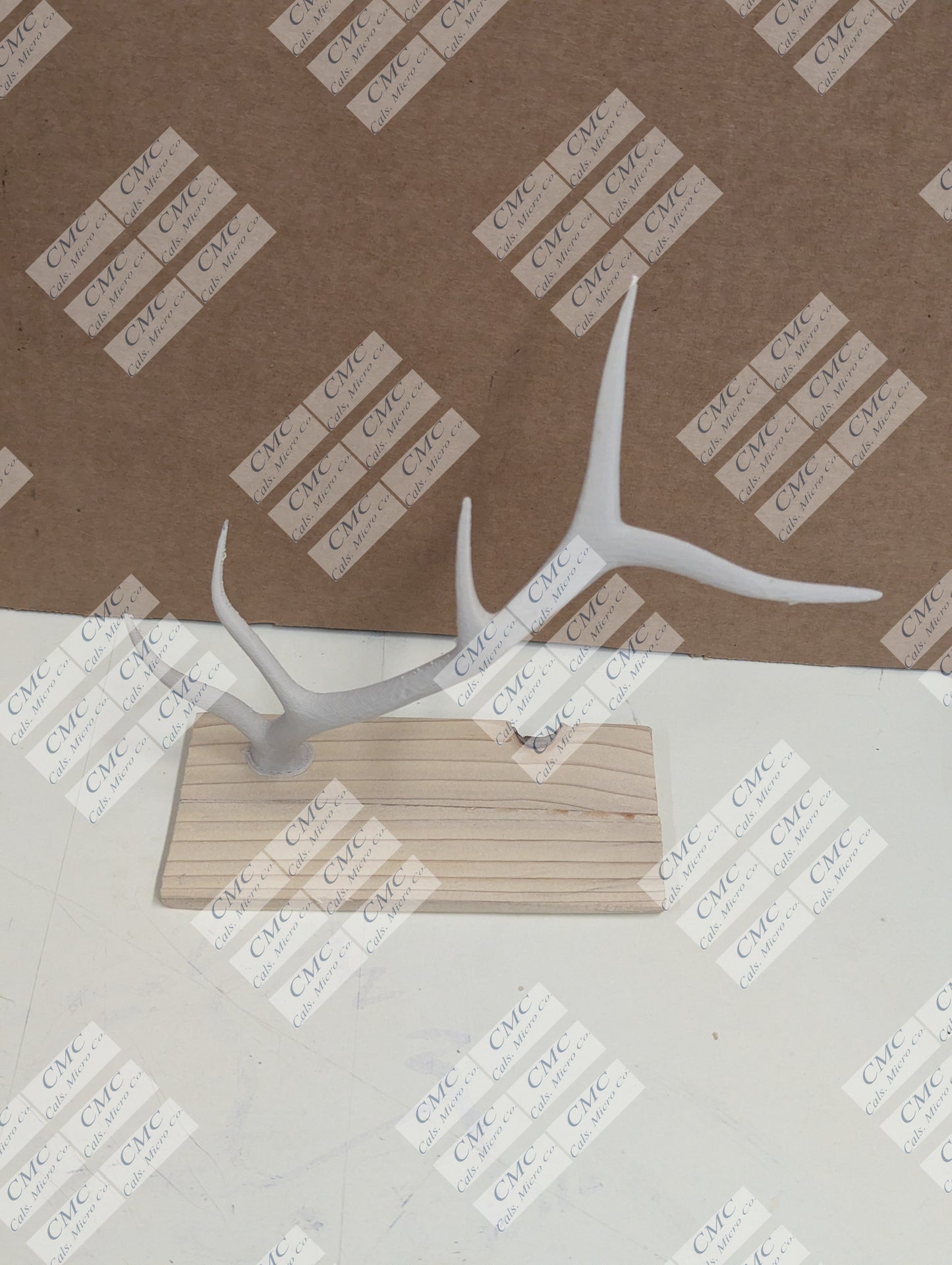 Wood base with cream white antler decor