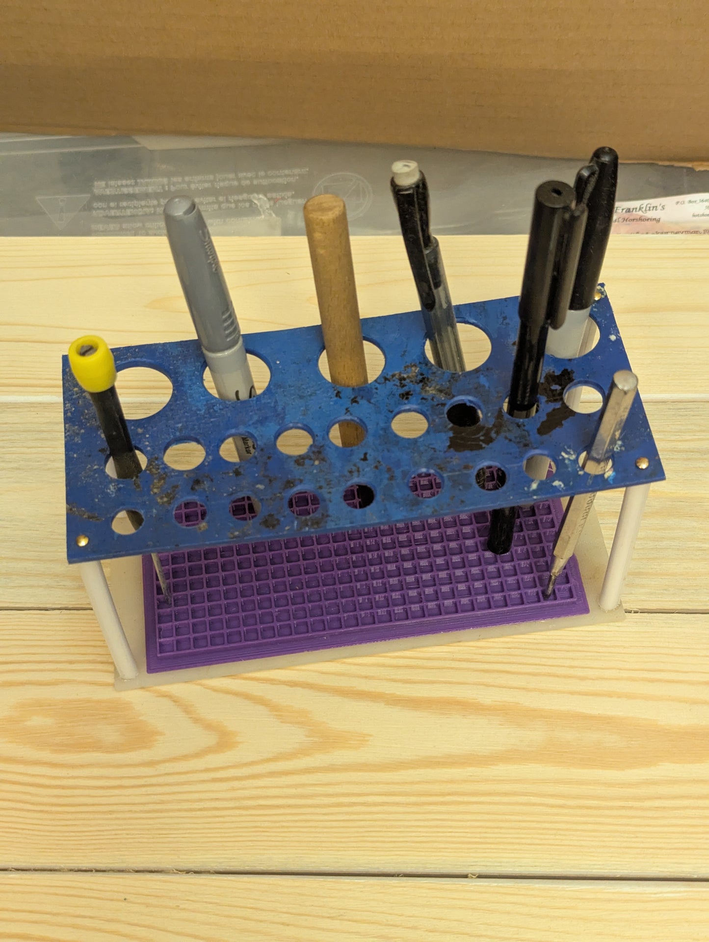 Multi function tool/pen rack